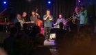 Band performing at JMI Live