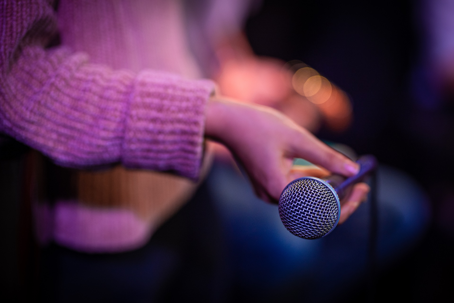 jazz voice holding a microphone