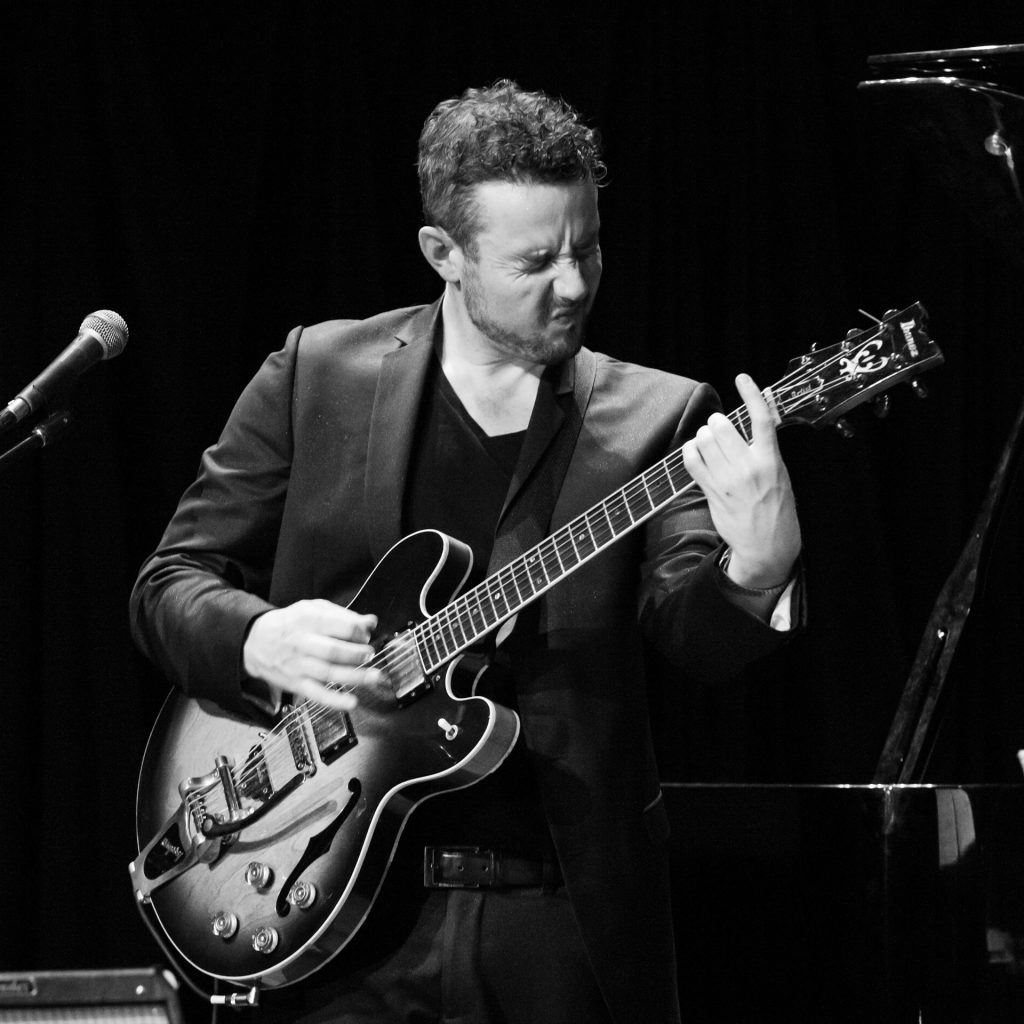 Ben Hauptmann playing guitar