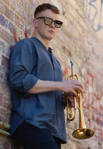 lachlan mckenzie holding a trumpet