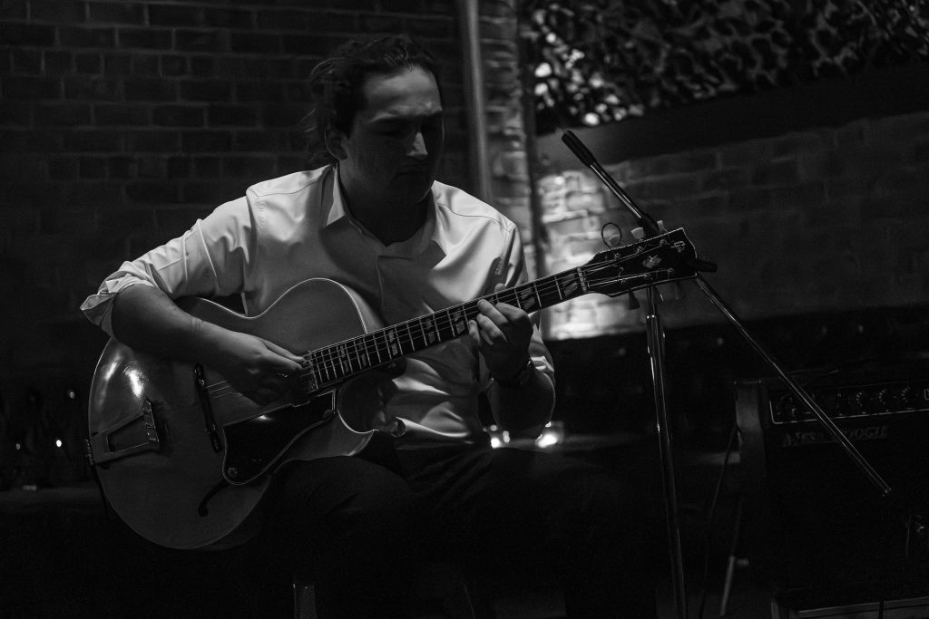 Lockie Bennett playing guitar