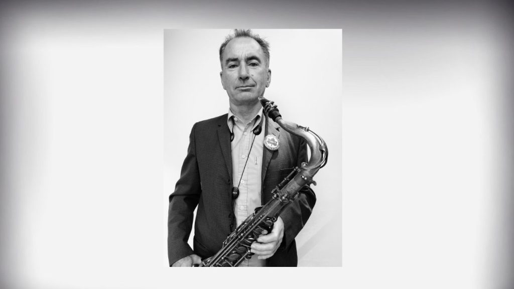 Graeme Norris holding a saxophone