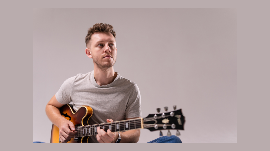 Tyler Cooney playing guitar